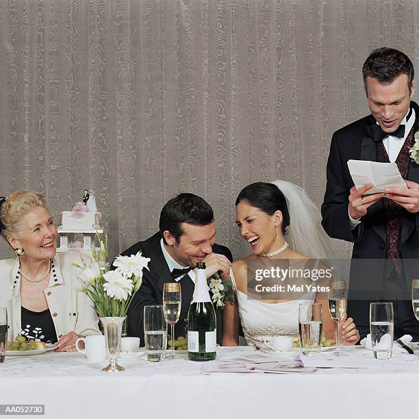 bride and groom laughing at best man's toast - best man stock pictures, royalty-free photos & images