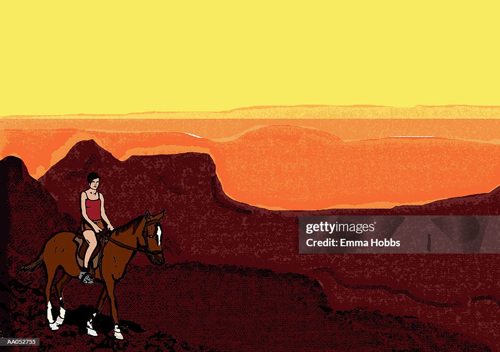 Woman riding horse through mountains at sunset