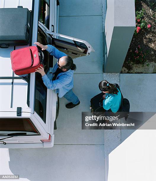 couple packing truck with suitcases, overhead view - supreme fiction stock pictures, royalty-free photos & images