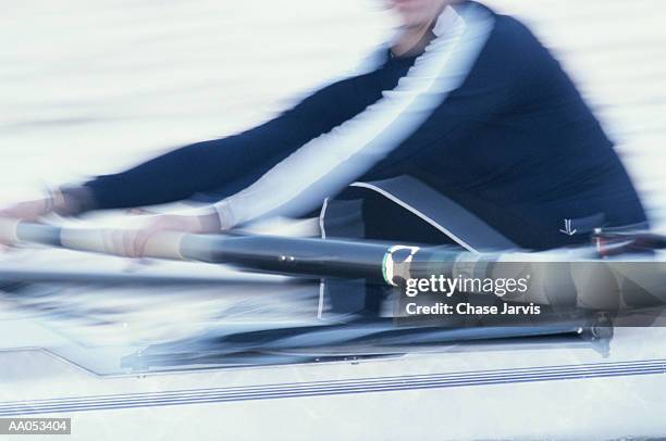 woman rowing on crew team, mid section (blurred motion) - remo de punta fotografías e imágenes de stock