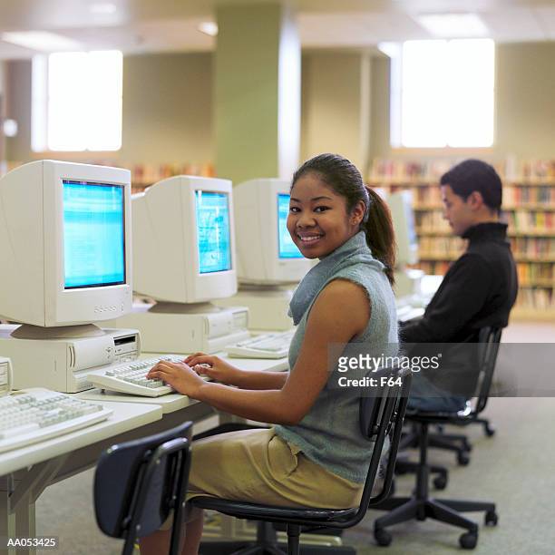 high school students using computers in school library - f 16 stock pictures, royalty-free photos & images