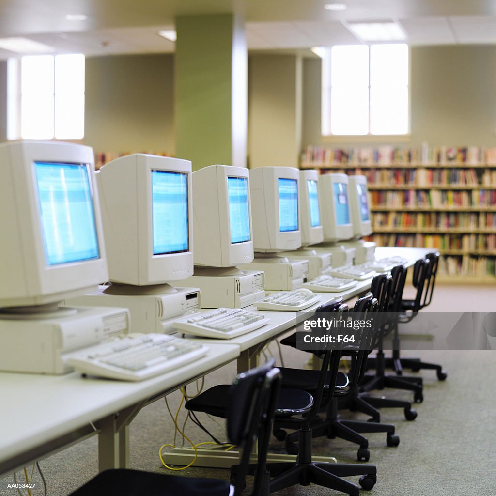 Empty high school library (focus on computers)