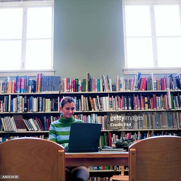 teenage girl (16-18) using laptop computer, high school library - f 16 stock pictures, royalty-free photos & images