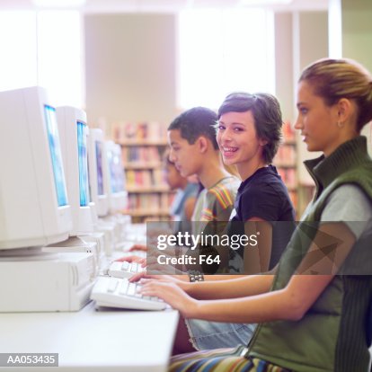 Random Students Using Computers Group Of High School Students Using Computers In School Library High ...