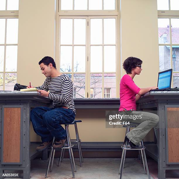 two high school students studying in classroom, side view - f 16 stock pictures, royalty-free photos & images