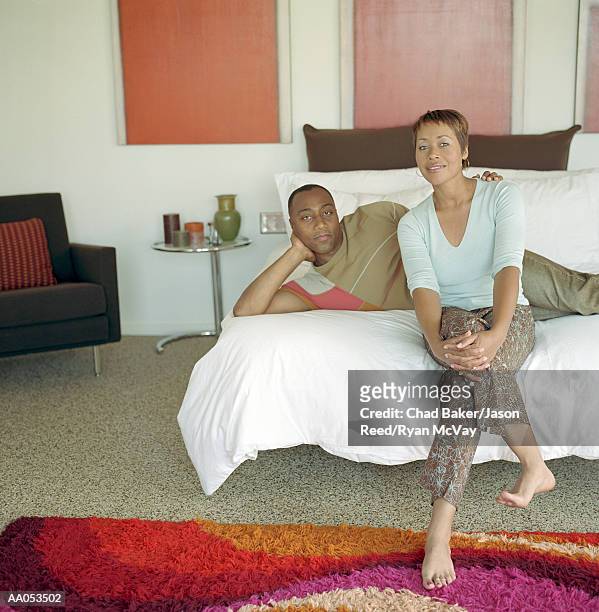 man and woman relaxing on bed, portrait - reed bed stock pictures, royalty-free photos & images