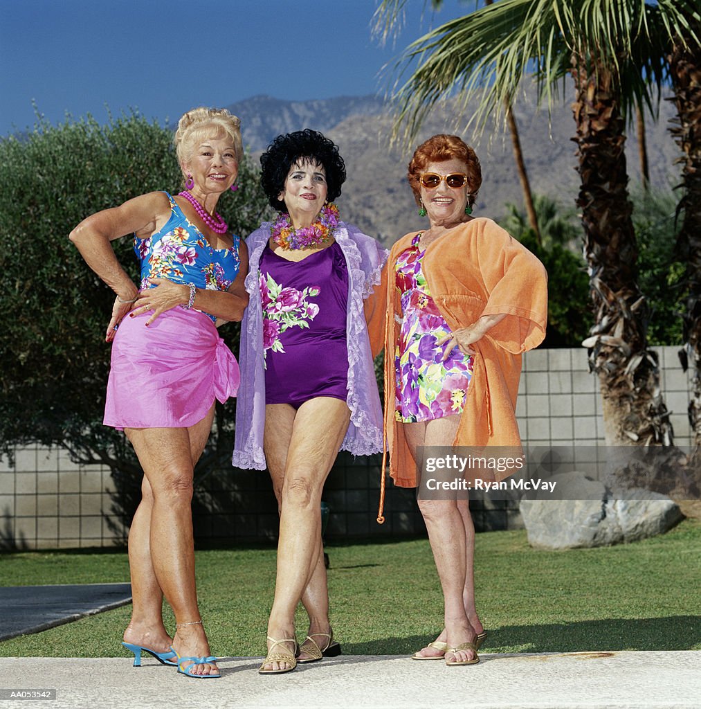 Three elderly women standing outdoors, smiling, portrait