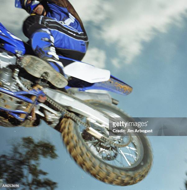 motocross rider in mid-air, low angle view (blurred motion) - low rider bildbanksfoton och bilder