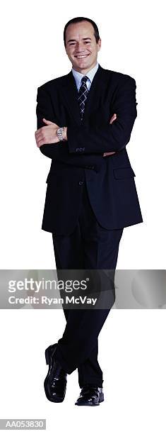 businessman standing with arms folded across chest - buisnessman studio clipping path bildbanksfoton och bilder