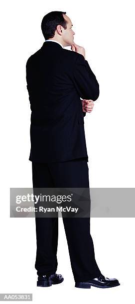 businessman holding chin, rear view - buisnessman studio clipping path stock-fotos und bilder