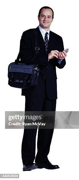 businessman holding mobile phone and carrying bag with laptop - buisnessman studio clipping path bildbanksfoton och bilder