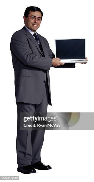 man holding laptop - buisnessman studio clipping path stock-fotos und bilder