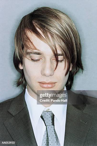 young businessman looking down, high section - circular strobe stock pictures, royalty-free photos & images
