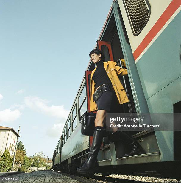 woman exiting train, low angle view - gå i land bildbanksfoton och bilder