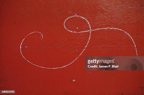 white curling chalk mark on red wall - chalk wall ストックフォトと画像