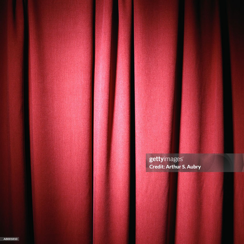 Folds in red curtain