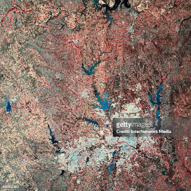 satellite view of city and lake - satellite view stock-fotos und bilder