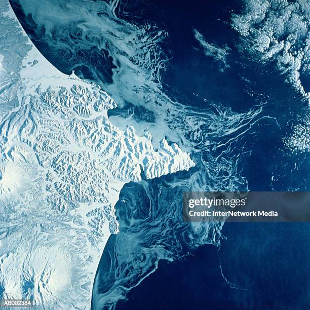 russian kamchatka peninsula from space - russian far east stock-fotos und bilder