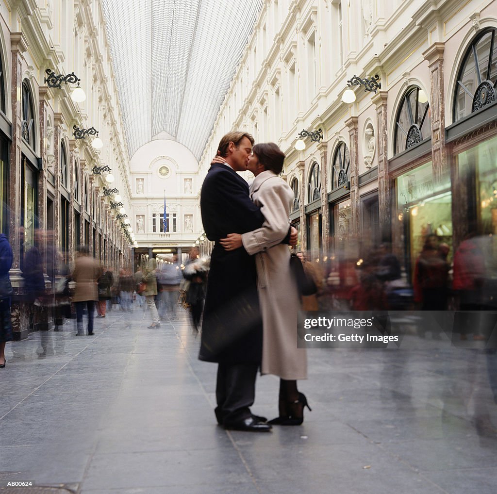 Couple kissing in gallery, St. Hubert, Brussels, Belgium