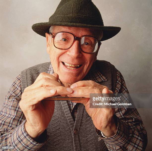 elderly man with harmonica, portrait - harmonica stock pictures, royalty-free photos & images