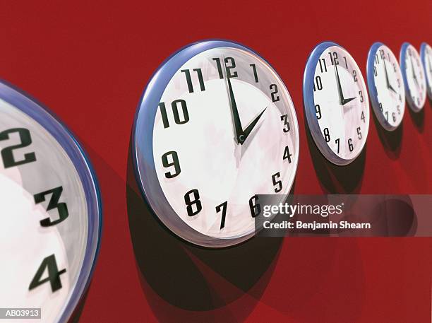 row of wall clocks (digital) - benjamin stock-fotos und bilder