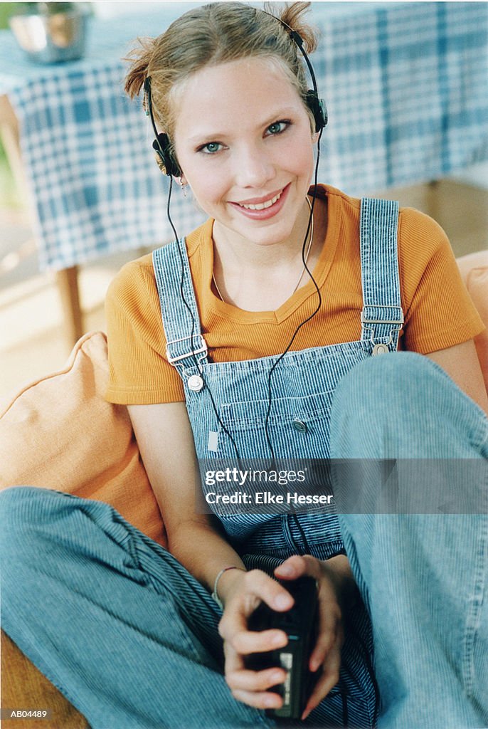 Teenage girl (15-17) wearing headphones, portrait