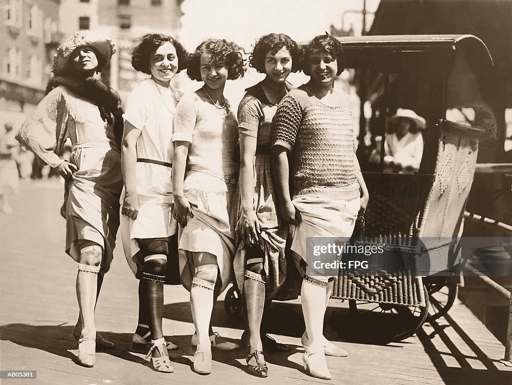 LINE OF WOMEN SHOWING THEIR GARTER BELTS / CIRCA 1920'S