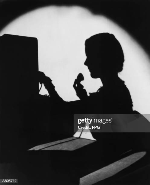 archive shot / silhouette of switchboard operator / indoors - telephone switchboard stock-fotos und bilder