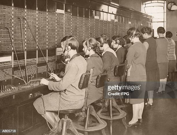 female telephone switchboard operators training, rear view (b&w) - archive 2005 stock-fotos und bilder