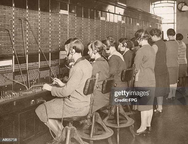 female telephone switchboard operators training, rear view (b&w) - archive 2005 foto e immagini stock