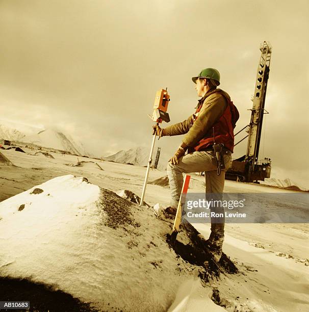 coal miner measuring blasting depth, rear view - belasting stock pictures, royalty-free photos & images