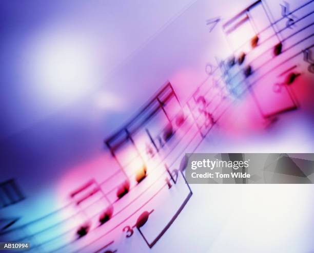 musical notes (blurred motion) - bladmuziek stockfoto's en -beelden
