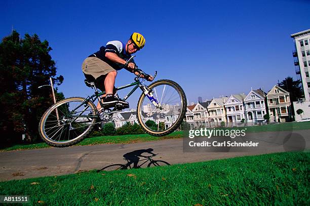 man on bicycle, mid-air - schneider stock pictures, royalty-free photos & images
