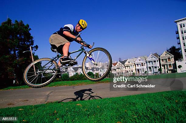 man on bicycle, mid-air - schneider bildbanksfoton och bilder