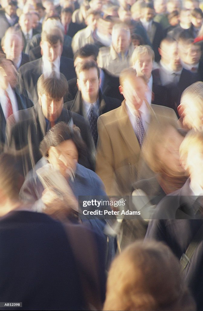 Commuters walking in city (blurred motion)