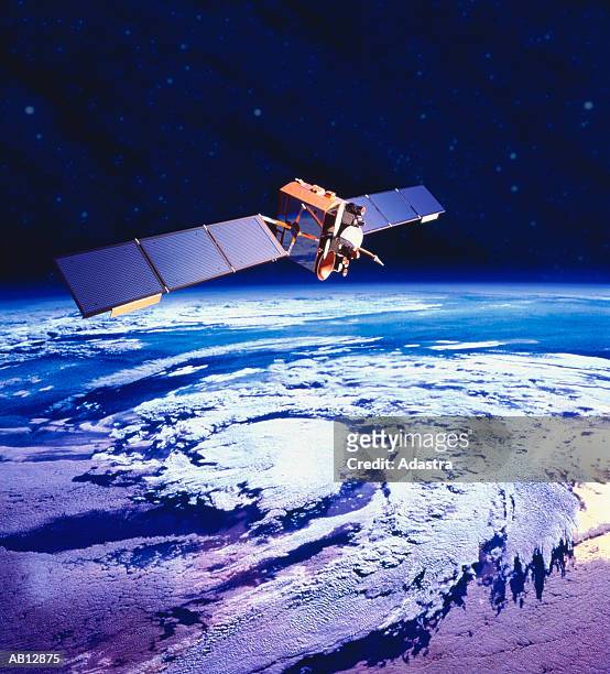 communications satellite orbiting earth (digital composite) - satélites imagens e fotografias de stock