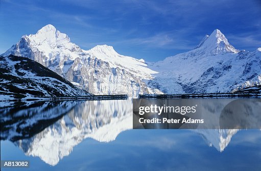 Switzerland, Swiss Alps, mountains reflected in lake water