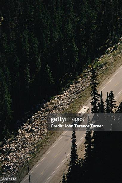 trailer on mountain road, aerial view - trailer stock pictures, royalty-free photos & images