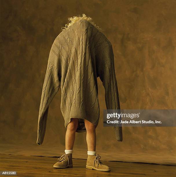 https://media.gettyimages.com/id/AB15580/photo/girl-lost-in-large-sweater.jpg?s=612x612&w=gi&k=20&c=TcQEu0ycupIXTmGmI5wt6PYLF2cCfmfbS6FDJAE56lI=