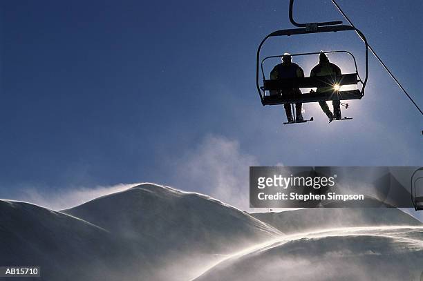 skiers on chair lift - colorado skiing stock pictures, royalty-free photos & images
