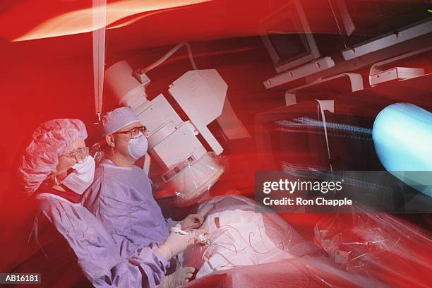 surgeon performing heart cathererization - heart surgeon stock pictures, royalty-free photos & images