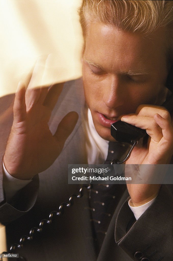 Businessman Talking on a Telephone