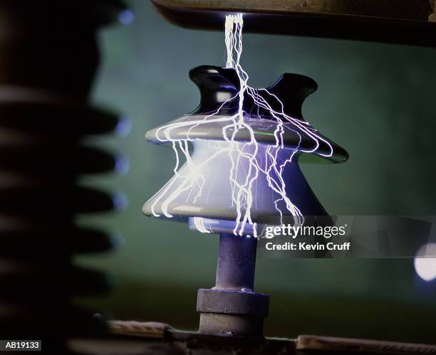 ceramic insulator undergoing quality control test - insulator stock pictures, royalty-free photos & images