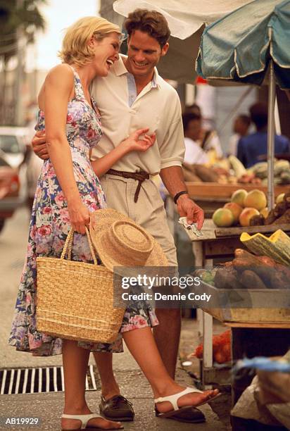 couple shopping at outdoor market, bridgetown, barbados - bridgetown barbados stock pictures, royalty-free photos & images