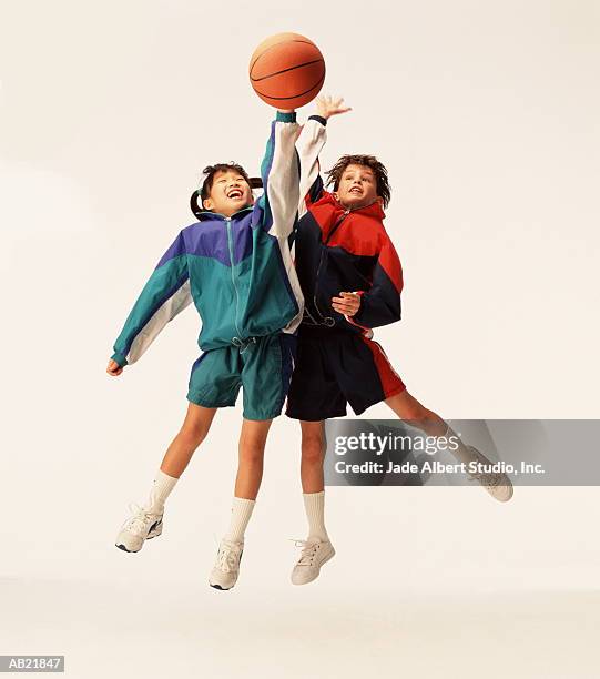 two girls (8-10) playing basketball - basketball shoe stock-fotos und bilder