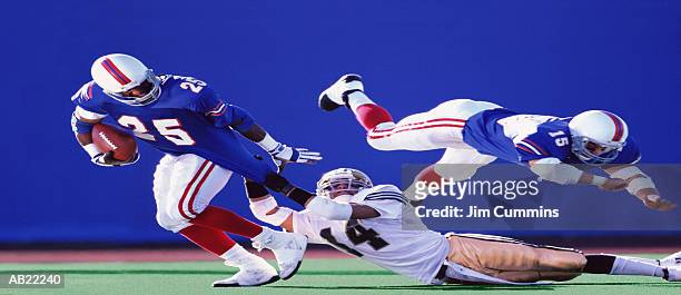 three men playing american football - quarterback stock pictures, royalty-free photos & images