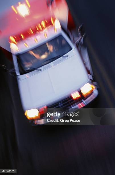 ambulance speeding, elevated view (blurred motion) - greg pease stock-fotos und bilder