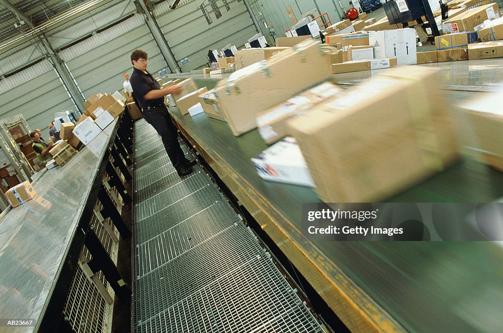 Worker sorting airmail