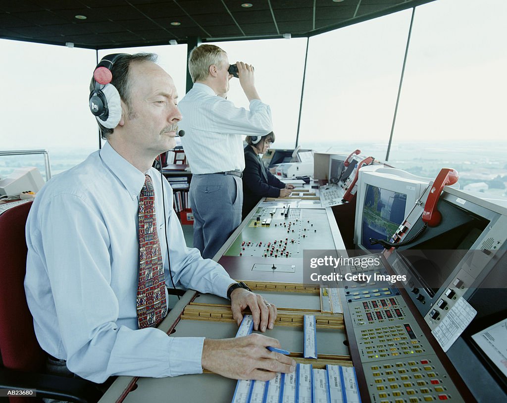 Workers Operating Air Traffic Control Tower High-Res Stock Photo