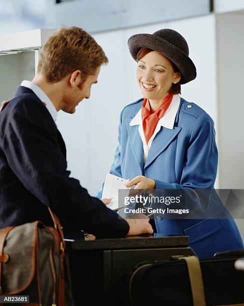 airline passenger checking in for flight - getty images uk stock pictures, royalty-free photos & images